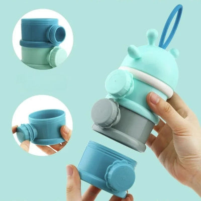 Boite doseuse lait bleue avec ouverture latérale individuelle, démontage facile et compartiments empilables pratiques pour préparer les biberons sans renverser.