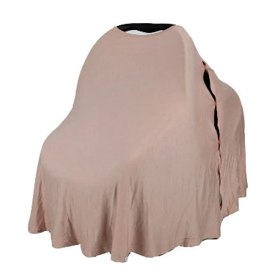 Cape d'allaitement beige clair utilisée comme couverture sur un siège bébé, offrant ombre et intimité en balade