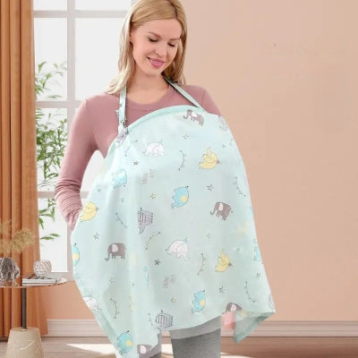 Cape allaitement bleu pastel avec imprimés éléphants, parfaite pour une tétée discrète et stylée à l’extérieur ou à la maison.