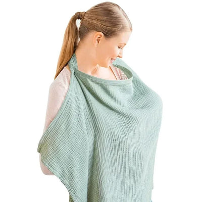 Cape d’allaitement vert amande en coton bio, parfaite pour les mamans qui allaitent dans des environnements variés en toute sérénité.