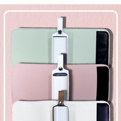 Variantes du chauffe biberon nomade MiniTétée™ en rose, blanc et vert, vue à plat pour présentation des modèles disponibles.