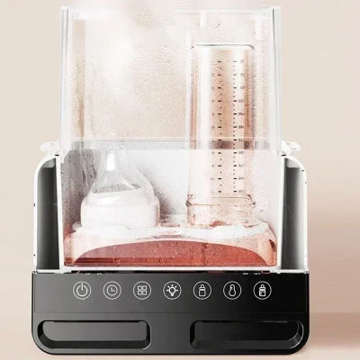 Chauffe biberon DuoWarm Elite™ en pleine fonction vapeur avec condensation visible, stérilisant deux biberons dans une chambre hermétique transparente.