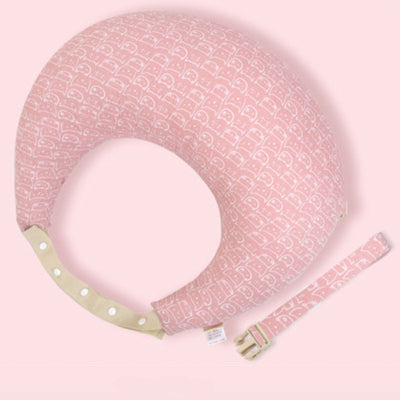Coussin d’allaitement rose en forme de croissant avec sangle ajustable, modèle simple pour soulager les bras et le dos pendant l’allaitement.