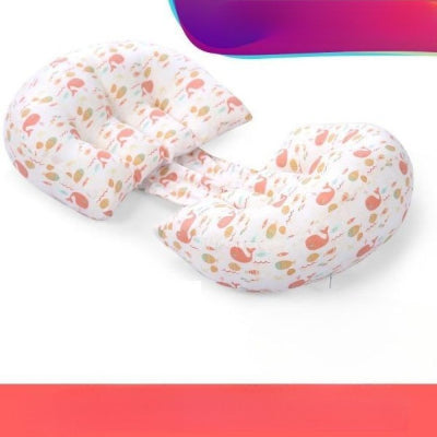 coussin grossesse multifonction à motif baleine rose sur fond blanc, conçu pour offrir un confort optimal pendant la grossesse