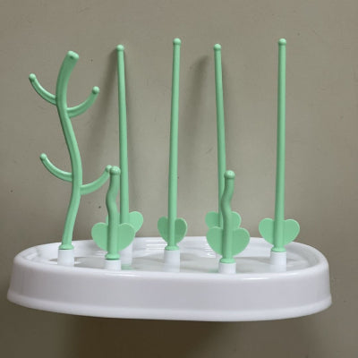 Egouttoir biberon vert pastel en forme de cactus avec tiges modulables, parfait pour sécher rapidement les biberons, tétines et accessoires dans une organisation biberonnerie.