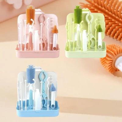Ensemble de goupillons biberon ZenBibi™ disponibles en rose, vert et bleu, avec support et accessoires pour un nettoyage complet.