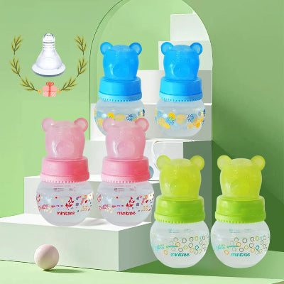 Lot de petits biberons pour nouveau-né avec capuchons ours, mini biberons premier âge colorés.