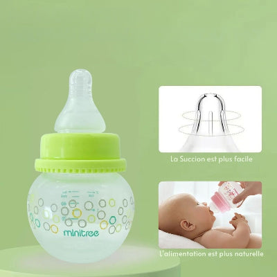 Petit biberon pour nouveau-né vert avec tétine à débit lent, idéal pour un allaitement naturel.