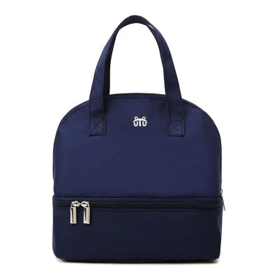 Sac bébé isotherme bleu marine, stylé et pratique pour conserver les repas chauds ou froids pendant les trajets.