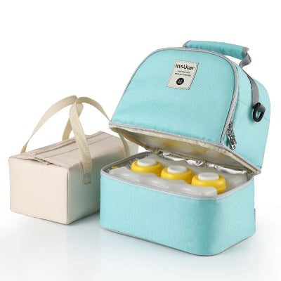 Sac isotherme Bebe menthe avec biberons et glaçons inclus pour la conservation du lait maternel durant les sorties avec bébé.