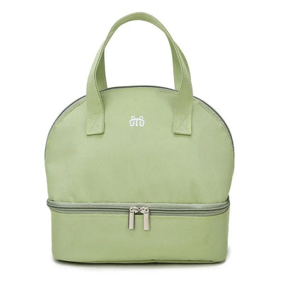 Sac isotherme de transport pour bébé en vert pastel, léger et multifonction, adapté à la crèche ou au pique-nique.