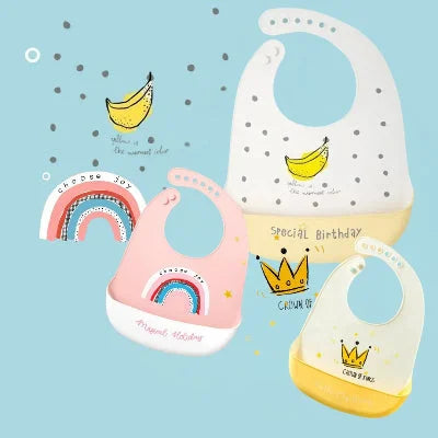 Bavoirs silicone MiniMiam TrioBib aux motifs arc-en-ciel et banane avec poche récupératrice