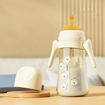 Biberon anti colique beige de 300 ml, idéal pour accompagner la croissance de bébé.