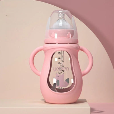  Biberon anti colique rose avec poignées et tétine en silicone pour une succion naturelle et sans reflux.