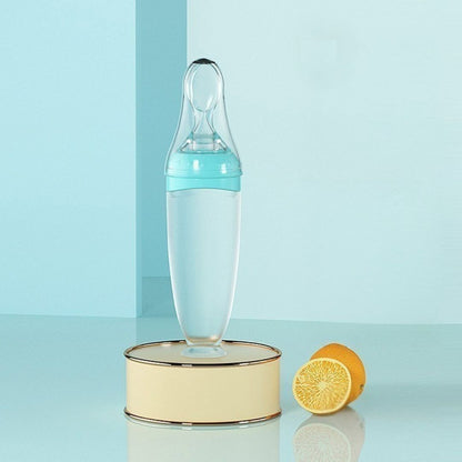 Biberon cuillère bleu 120ml avec bouchon anti-fuite et filtre à trous croisés offerts pour une alimentation sereine.