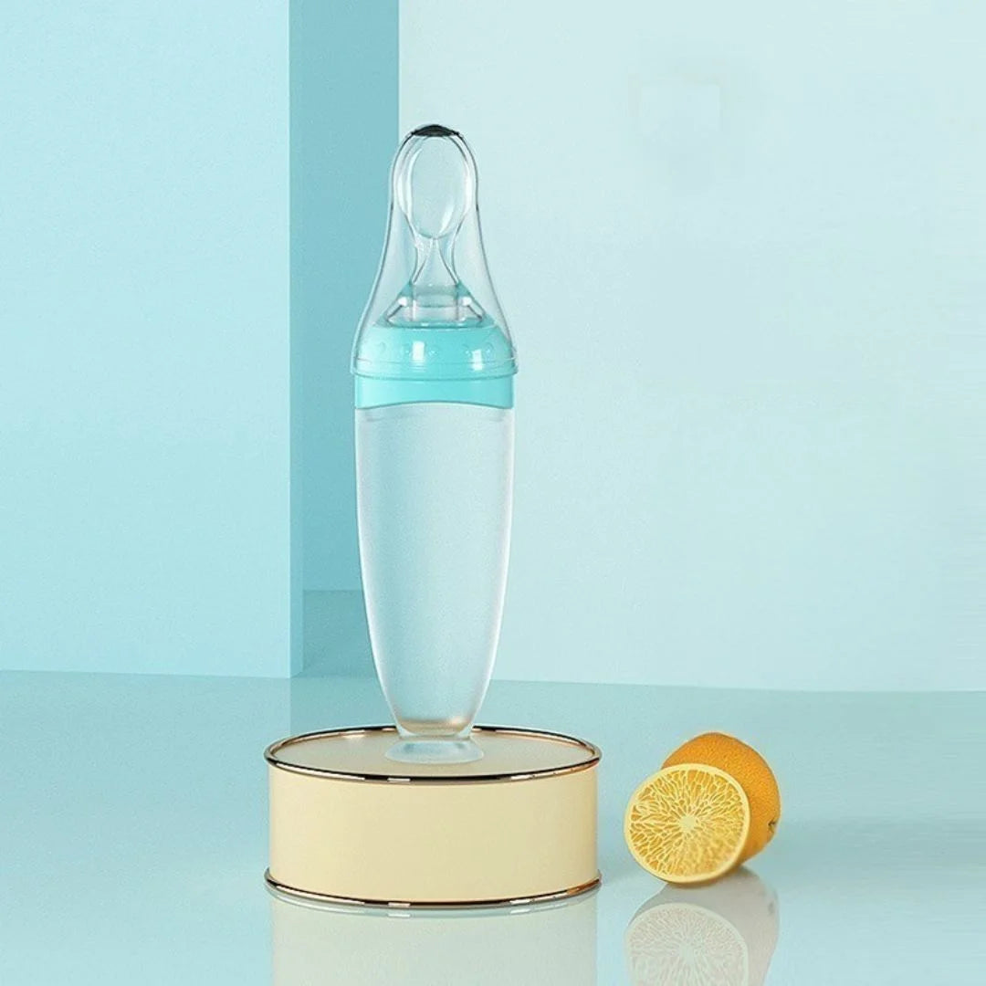 Biberon cuillère bleu 120ml avec bouchon anti-fuite et filtre à trous croisés offerts pour une alimentation sereine.