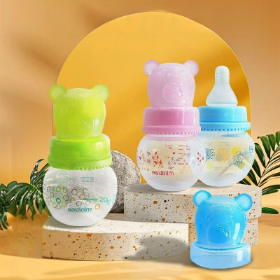 Biberon pour nouveau-né avec capuchon ours coloré, petit format anti-colique.