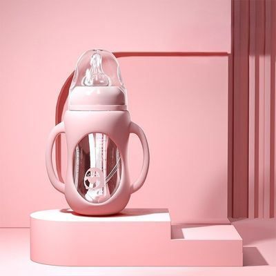 Biberon en verre rose 240 ml avec poignée ergonomique et protection silicone antichute