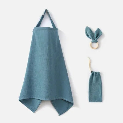Cape d’allaitement bleu gris en coton respirant avec accessoires assortis, offrant confort et discrétion en toute circonstance.