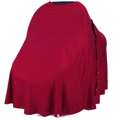 Cape pour allaitement Solène bordeaux posée sur mannequin siège auto — coupe circulaire 360°, coton tricoté extensible fond blanc