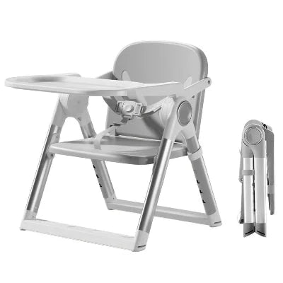 Chaise haute évolutive bébé pliable compacte en coloris gris, harnais sécurisé et plateau amovible facile à nettoyer.