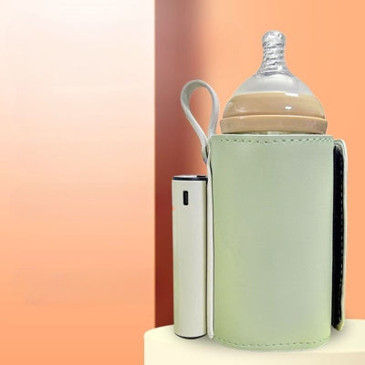 Chauffe biberon sans fil vert rechargeable avec revêtement en cuir PU, format compact et poignée de transport pratique.