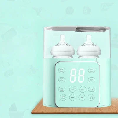 Chauffe biberon vert avec double compartiment pour biberons, écran LED tactile et fonctions multifonctions pour lait bébé à température idéale.

