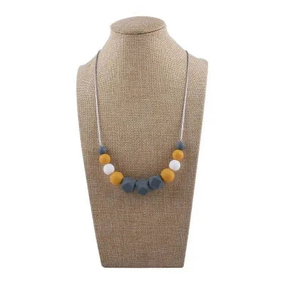 Collier d’allaitement aux perles jaunes et blanches en silicone alimentaire, monté sur fil sécuritaire, idéal pour la dentition de bébé