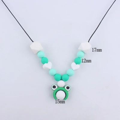 Collier d’allaitement grenouille avec détails de dimensions des perles en silicone, soulagement dentaire et sécurité garantie.