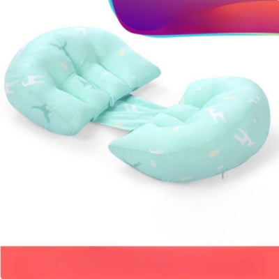 Coussin de grossesse couleur menthe conçu pour favoriser une position de sommeil latéral confortable et un bon alignement de la colonne vertébrale.