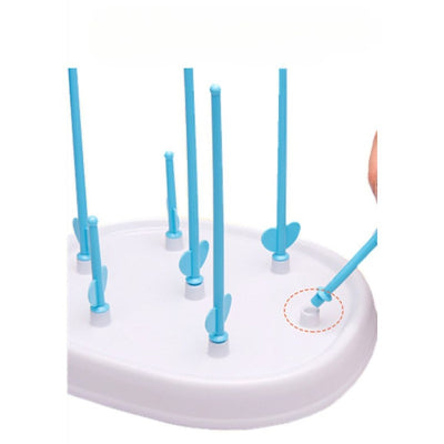 Egouttoir biberon bleu démontable avec tiges amovibles pour un nettoyage facile, idéal pour une hygiène bébé parfaite et un rangement optimisé en cuisine.