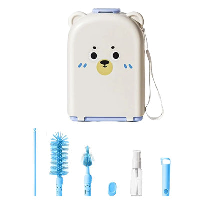 Kit bleu SoftTétin™ avec brosses silicone, flacon et boîte de transport rigide en forme d’ourson, parfait pour les déplacements.