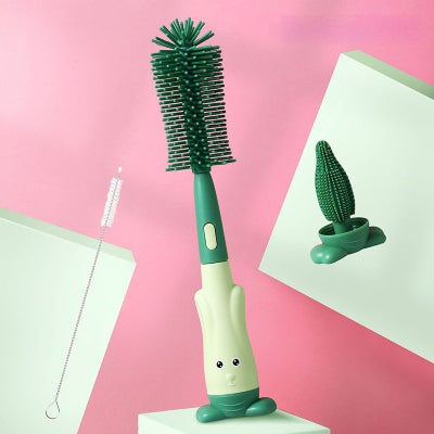 Goupillon biberon vert avec poignée ergonomique, picots souples et support stable pour un séchage rapide et sans contact avec les surfaces.