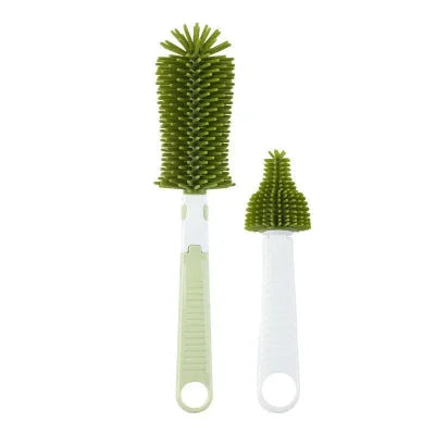Goupillon pour biberon vert en silicone avec grande brosse et mini goupillon intégré, pratique pour un nettoyage complet des biberons et tétines.