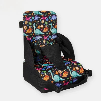 Coussin rehausseur chaise pliable pour bébé motif dinosaures, siège repas bébé pratique, idéal pour les repas à la maison ou en voyage.