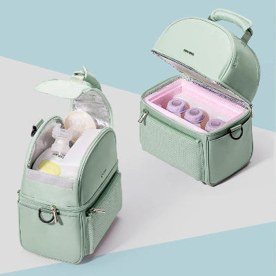 Vue en coupe montrant l’organisation interne du sac isotherme bébé avec deux compartiments distincts : un pour les biberons et un pour le tire-lait ou les encas.