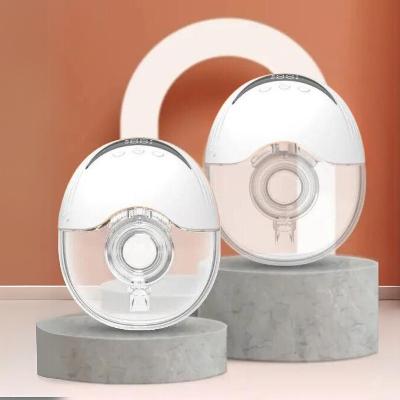 Deux tire-laits compacts présentés sur un socle, conçus pour offrir praticité et discrétion.