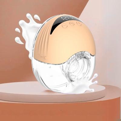 Tire-lait électrique design compact et élégant avec coque dorée, adapté à une utilisation discrète.
