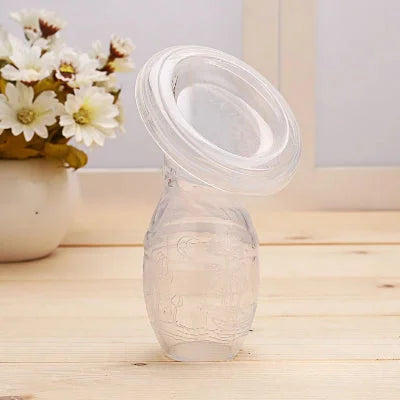 Tire-lait manuel en silicone transparent pour une extraction naturelle et confortable.